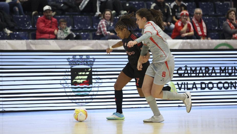 Women futsal players in action in custom kits